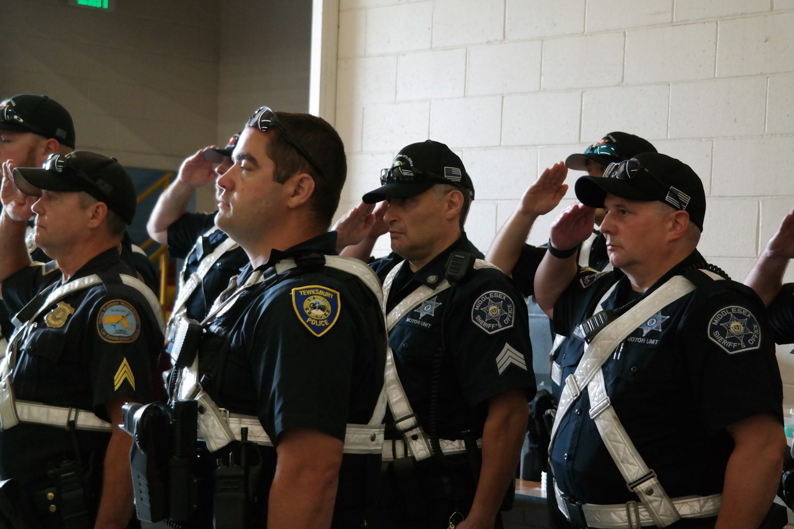Middlesex Sheriff's officers standing at salute