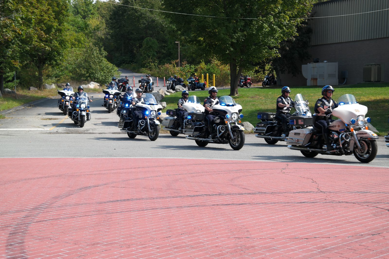 A line of police motorcycles rolling out at the start of the ride